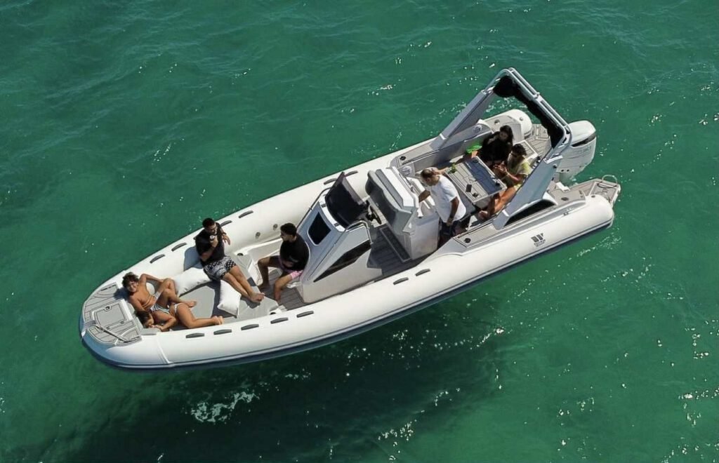 GR Boat Rental Skiathos Boat Hire Skiathos Rent Tiger Topline Limited Edition in Skiathos for up to 10 people, featuring a powerful 300hp engine, sunbathing area, refrigerator, music system, and onboard shower. Perfect for private family tours and snorkeling adventures with a professional skipper included.